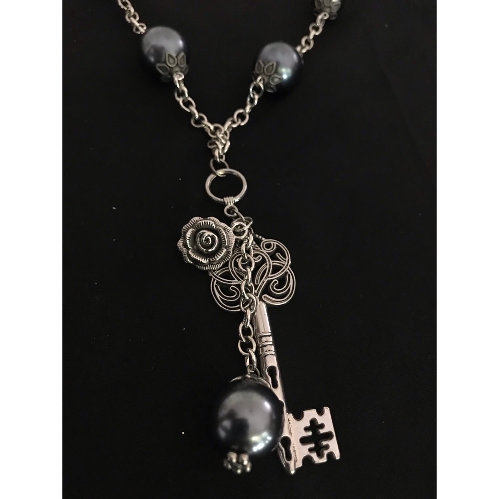 Silver Key charm necklace.